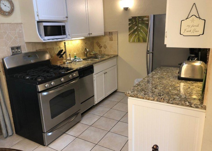 Full size kitchen, gas stove, fully stocked with dishes and all you need
